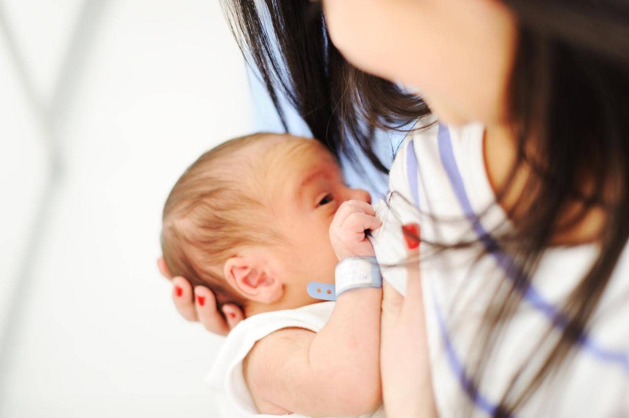 Understanding Why Your Baby Grabs Your Mouth While Breastfeeding